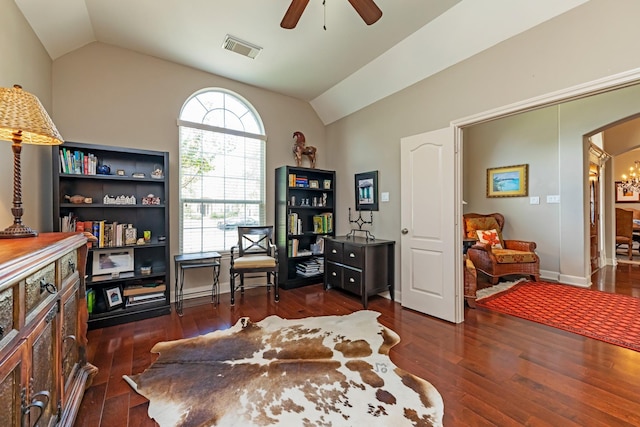 home office with lofted ceiling, dark hardwood / wood-style floors, and ceiling fan with notable chandelier