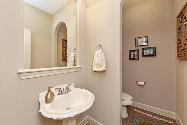 bathroom with sink and toilet