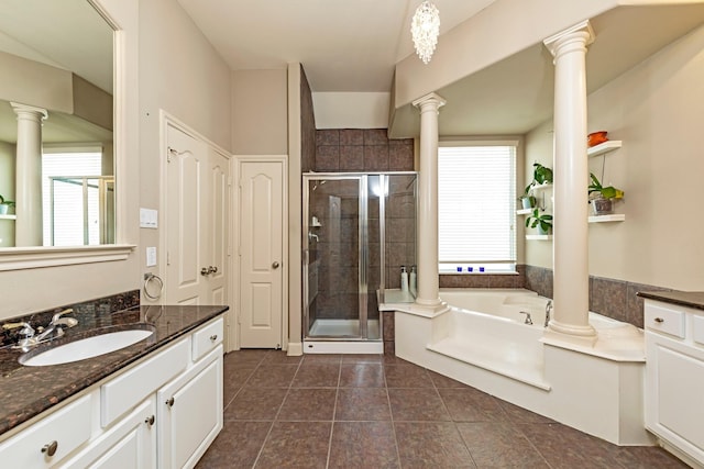 bathroom featuring tile patterned floors, vanity, and shower with separate bathtub