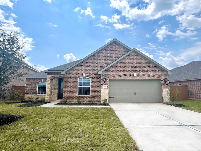 view of front facade with a front yard and a garage