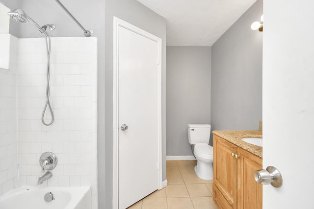 full bathroom featuring toilet, tiled shower / bath combo, tile patterned floors, and vanity