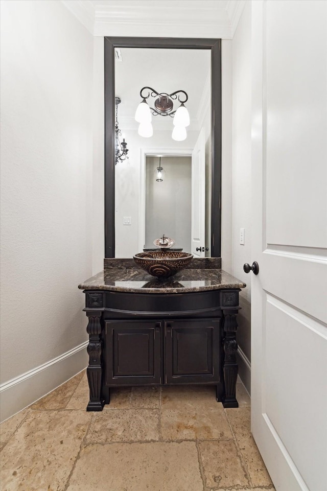 bathroom with vanity and crown molding