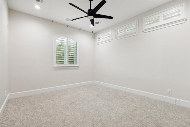 empty room with carpet floors and ceiling fan