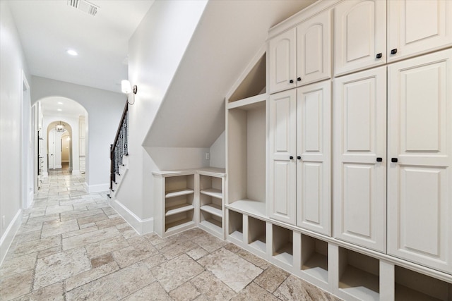 mudroom featuring vaulted ceiling