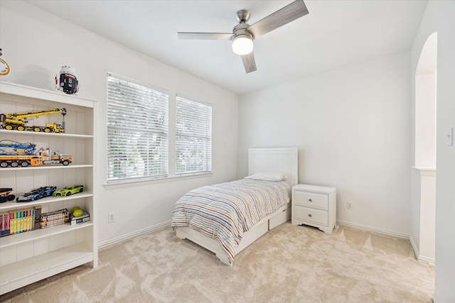 carpeted bedroom featuring ceiling fan