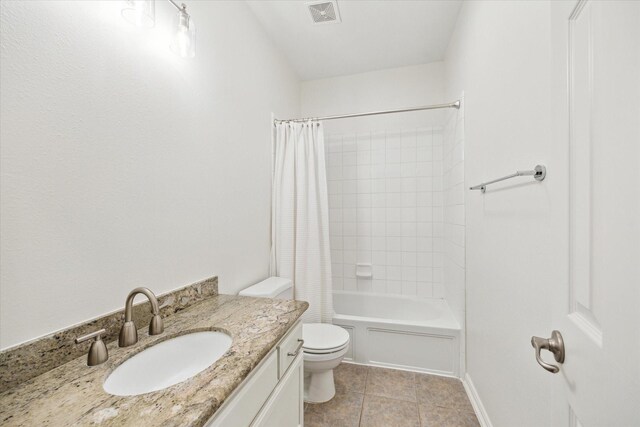 full bathroom with shower / tub combo with curtain, vanity, toilet, and tile patterned flooring