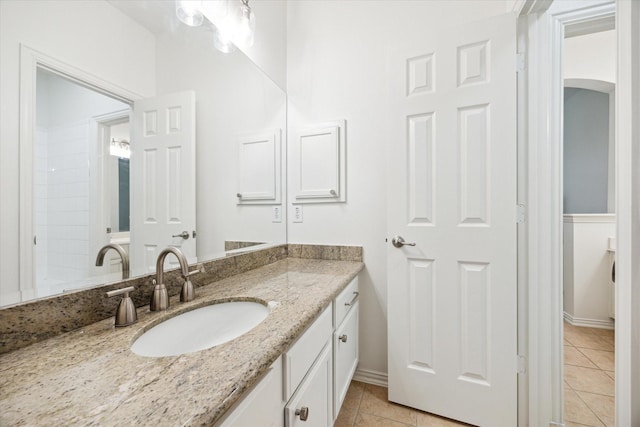 bathroom with vanity and tile patterned flooring