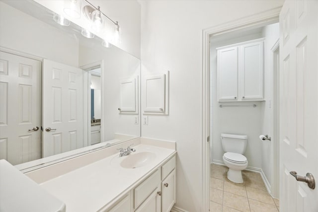 full bathroom with baseboards, vanity, toilet, and tile patterned floors