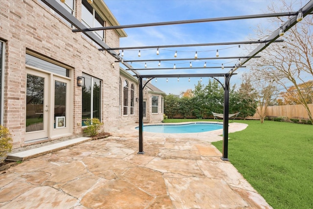 view of pool featuring a pergola, a lawn, and a patio