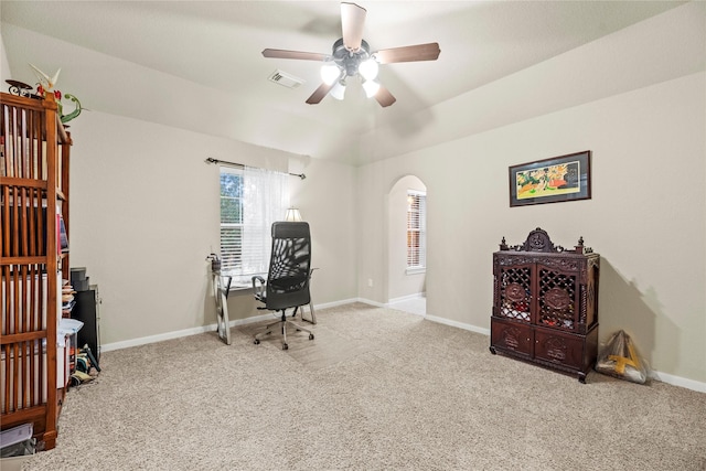 carpeted office with ceiling fan