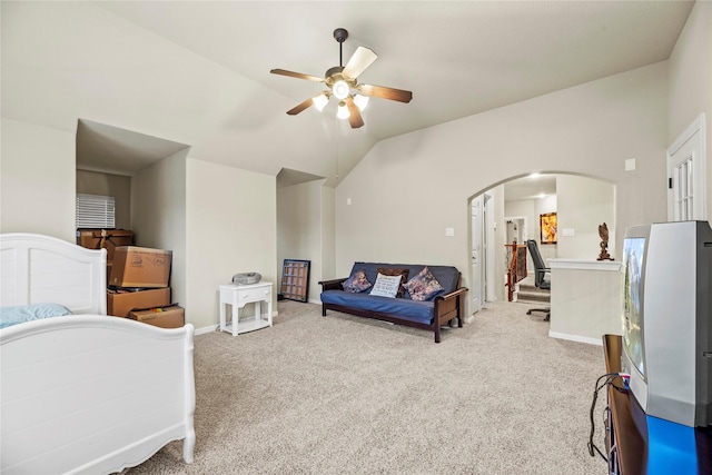 bedroom with light carpet, ceiling fan, and lofted ceiling