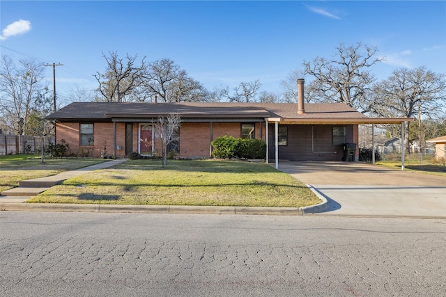 single story home with a front lawn and a carport