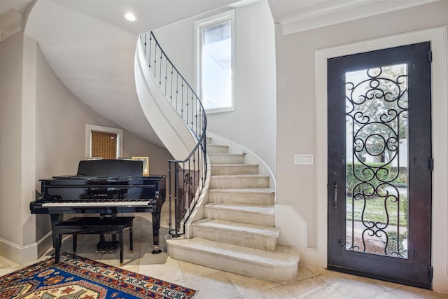 tiled foyer with crown molding