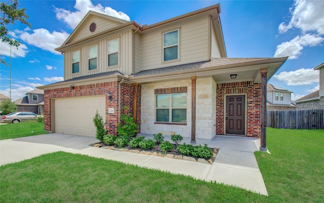 view of front of property with a front yard and a garage