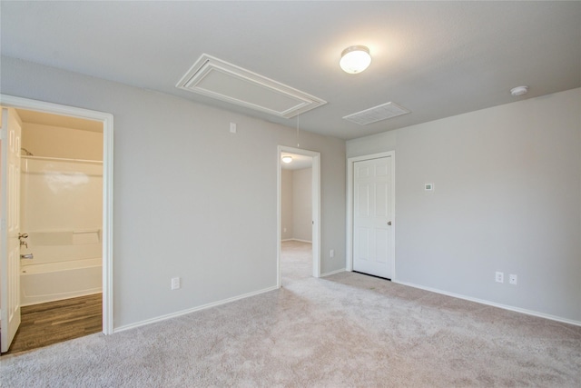 spare room with light carpet