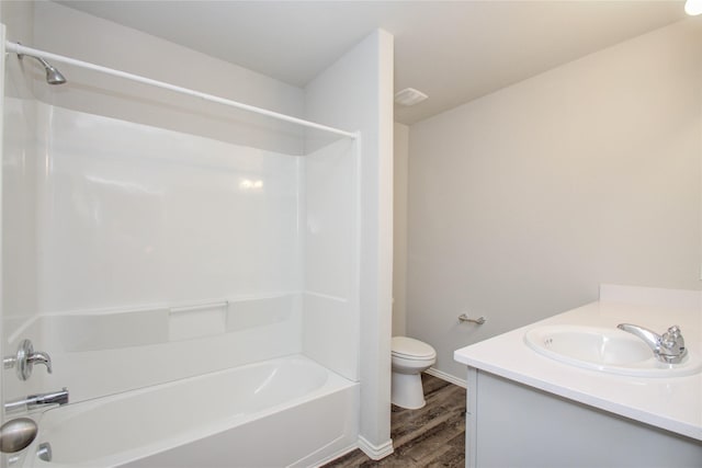 full bathroom with shower / bathtub combination, wood-type flooring, toilet, and vanity