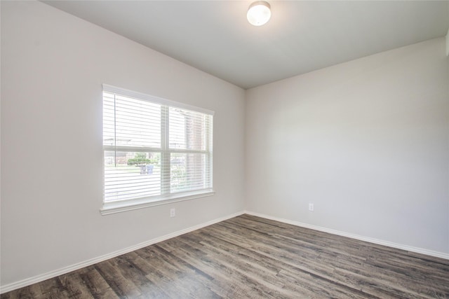 unfurnished room featuring dark hardwood / wood-style floors