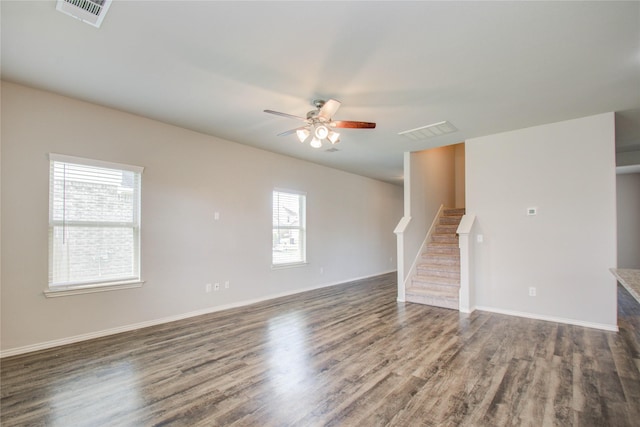 unfurnished living room with ceiling fan and dark hardwood / wood-style floors