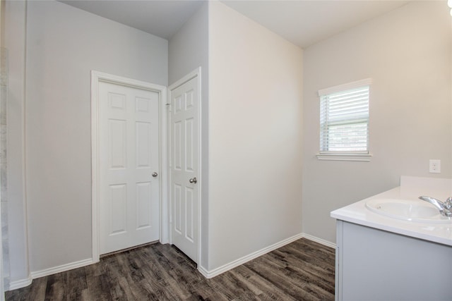 bathroom with hardwood / wood-style flooring and vanity