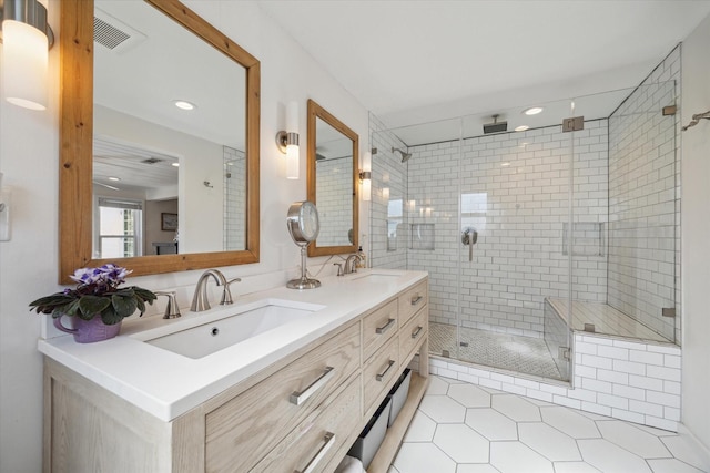 bathroom featuring vanity, tile patterned flooring, and a shower with door