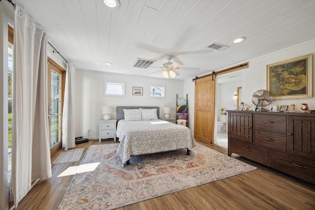 bedroom with wood ceiling, multiple windows, ceiling fan, light hardwood / wood-style flooring, and a barn door