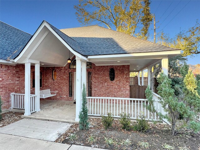 view of front of property featuring covered porch