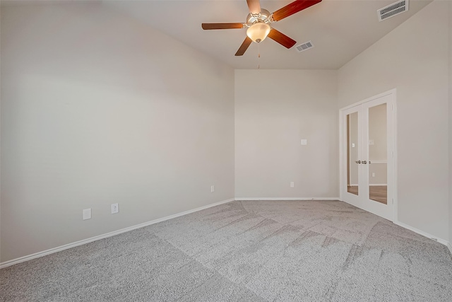 unfurnished room with ceiling fan, french doors, and carpet floors