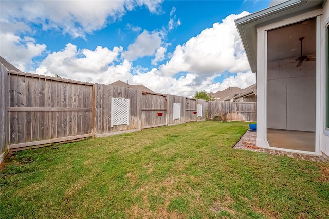 view of yard featuring ceiling fan