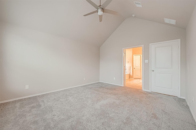 unfurnished bedroom with ceiling fan, light colored carpet, and vaulted ceiling