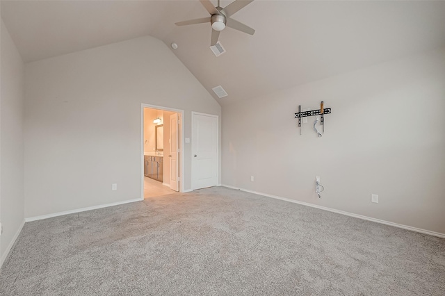 unfurnished bedroom featuring ceiling fan, light colored carpet, connected bathroom, and lofted ceiling