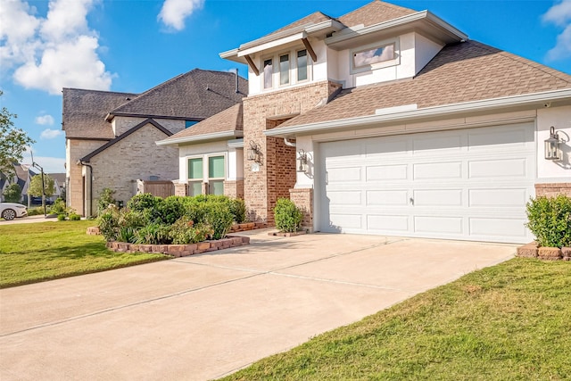 view of front of home with a front lawn and a garage