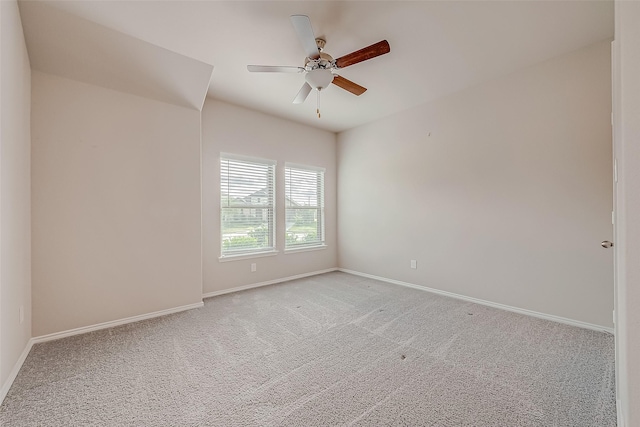 spare room featuring light carpet and ceiling fan