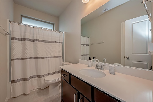 bathroom with toilet, tile patterned floors, vanity, and curtained shower