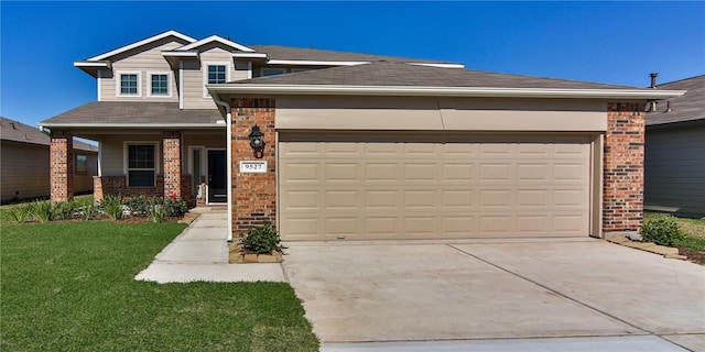 view of front of home featuring a garage and a front lawn