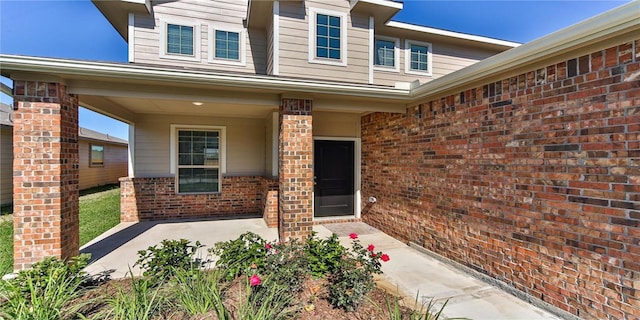 entrance to property with a patio