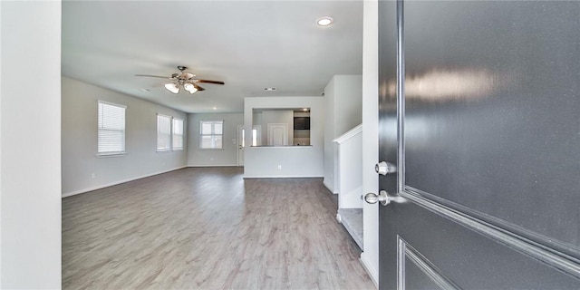 unfurnished room with ceiling fan and hardwood / wood-style floors