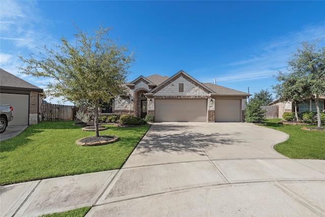 view of front of house featuring a front yard and a garage