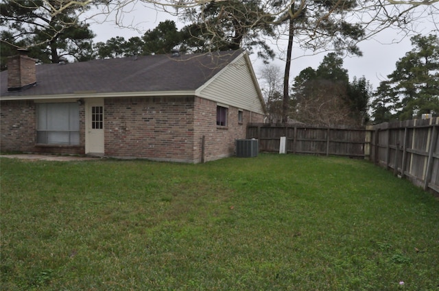 view of yard with central air condition unit