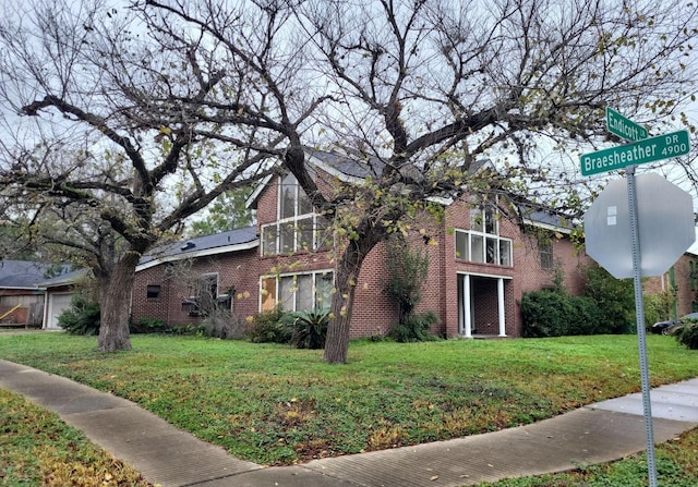 view of home's exterior featuring a lawn