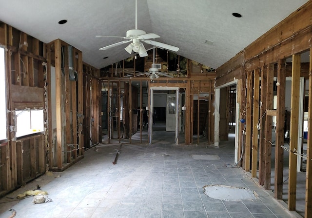 miscellaneous room featuring ceiling fan and lofted ceiling