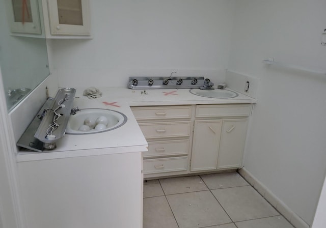 interior space featuring tile patterned floors and vanity