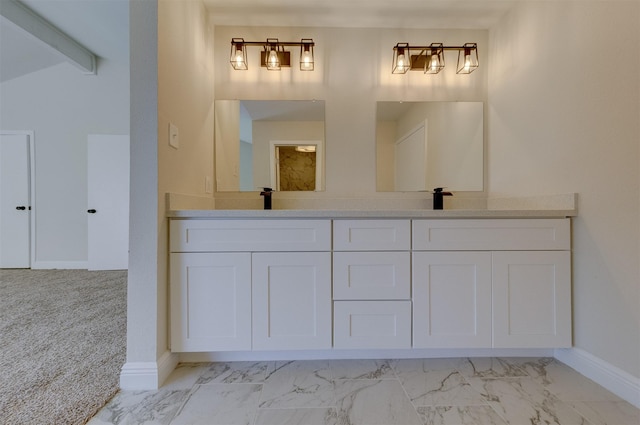 bathroom with vaulted ceiling with beams and vanity