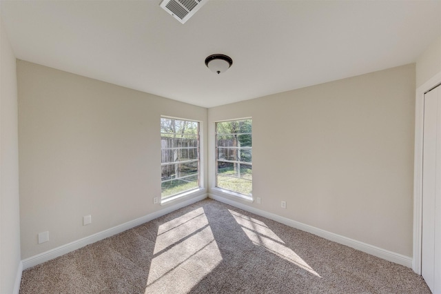 view of carpeted spare room