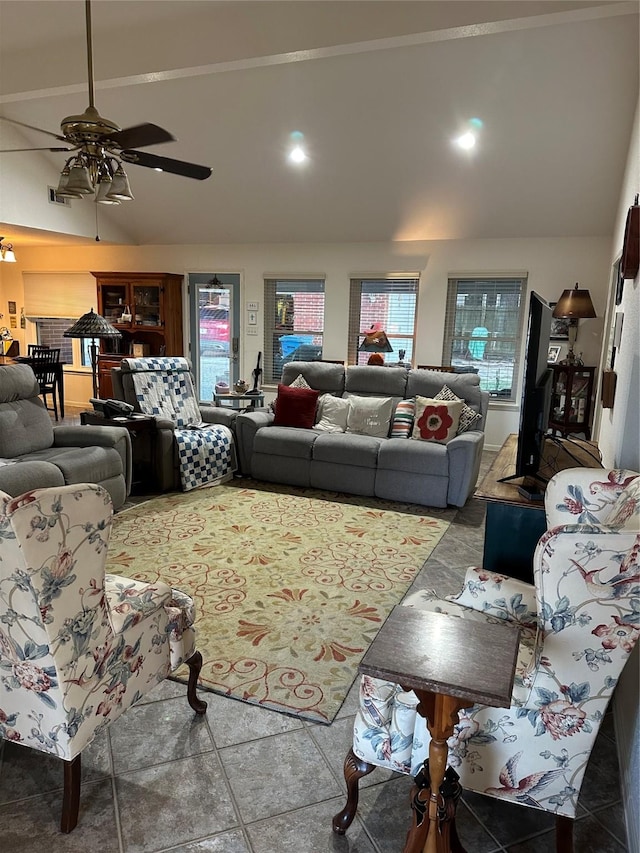 living room featuring ceiling fan and vaulted ceiling