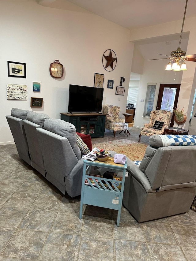 living room featuring ceiling fan and high vaulted ceiling