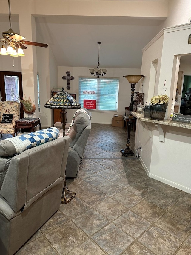 living room featuring ceiling fan with notable chandelier