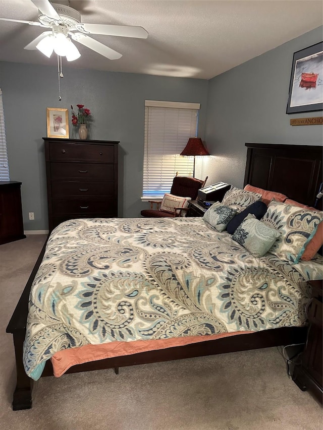 bedroom featuring ceiling fan and carpet flooring