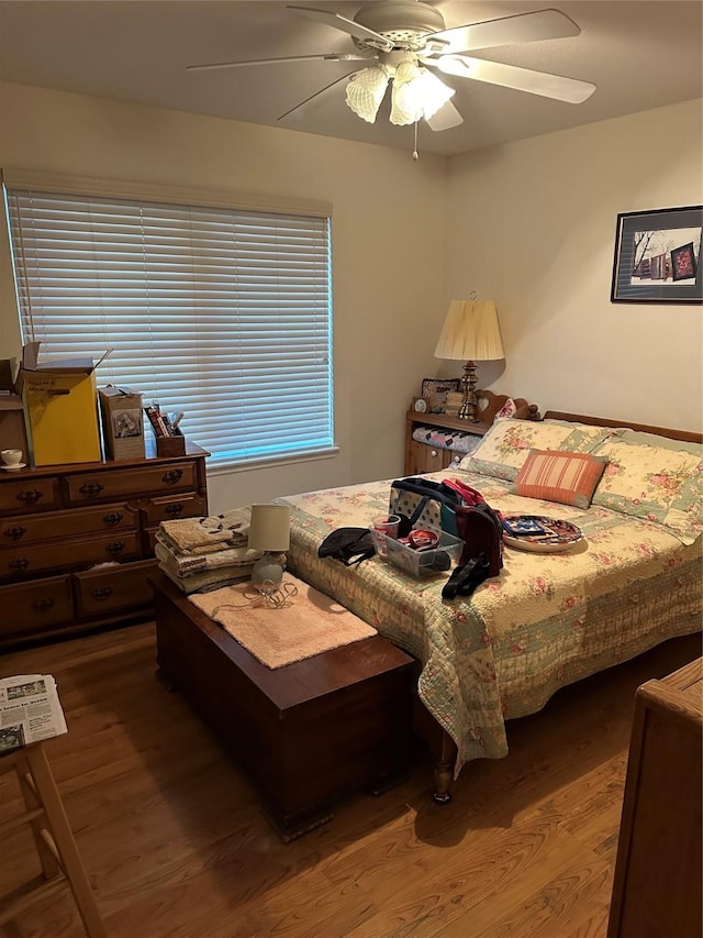 bedroom featuring ceiling fan and hardwood / wood-style floors