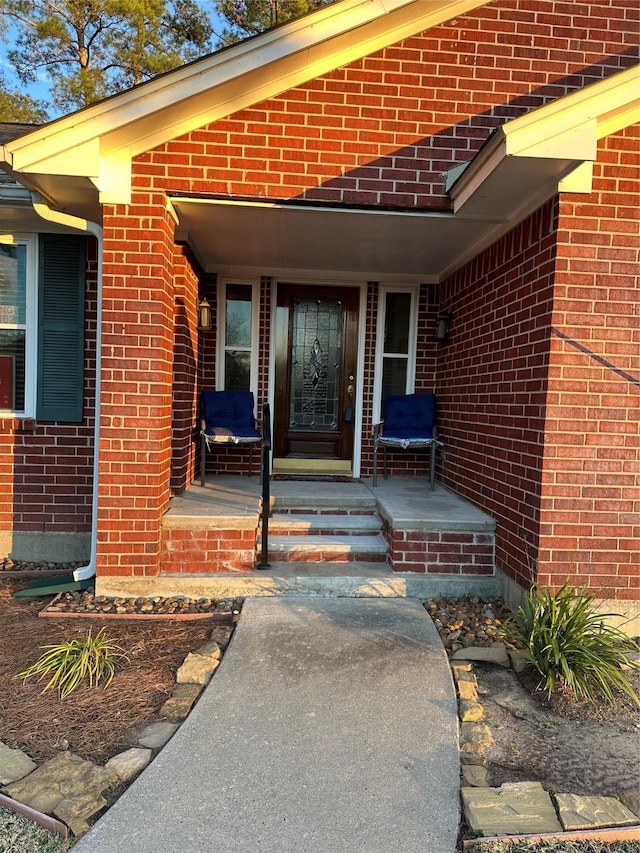 entrance to property featuring covered porch