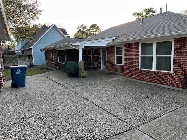 back of property featuring a patio